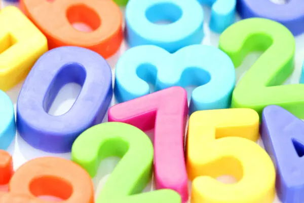 Row of colorful plastic numbers in sequence.