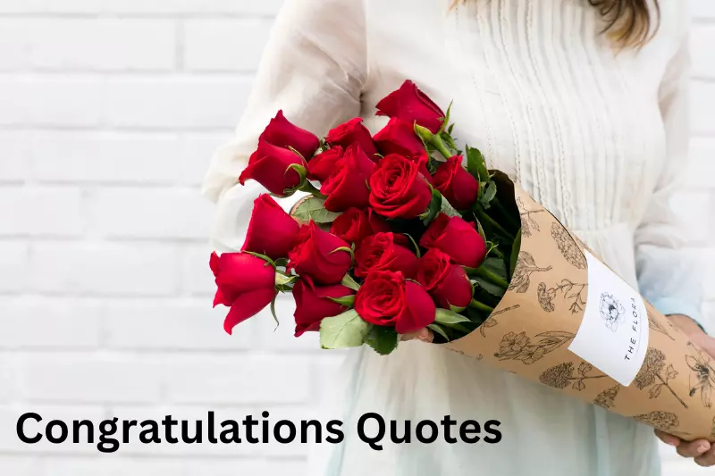 A woman gracefully holds a vibrant bouquet of red roses, showcasing their beauty and elegance in her hands.