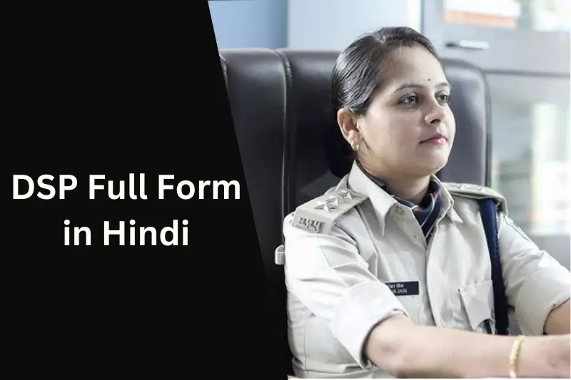 A woman in uniform seated at a desk, focused on her work, with a professional demeanor and organized workspace.